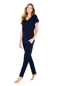 Woman wearing midnight blue Pima cotton loungewear sleepwear set on white background
