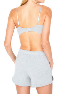 Woman in heather gray loungewear bra and shorts, back view, soft Pima cotton fabric