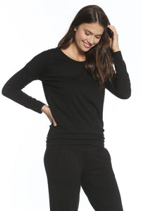 Woman wearing black long sleeve Pima cotton loungewear top and pants set