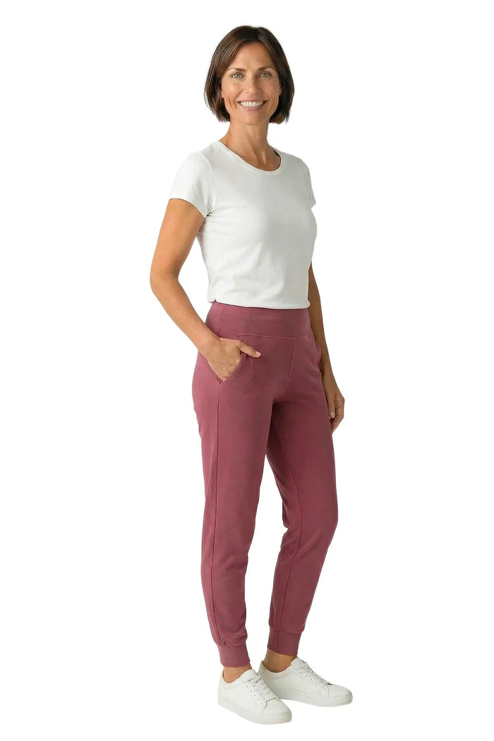 Woman wearing rosewood jogger pants and white t-shirt, casual loungewear style