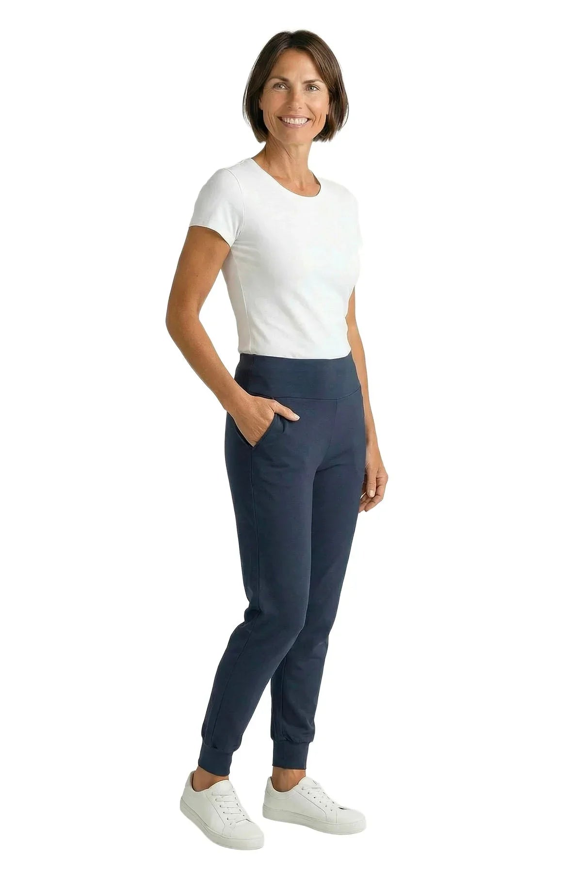 Woman wearing soft white tee and steel blue jogger loungewear pants on white background