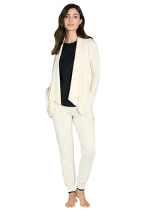 Woman wearing cream loungewear cardigan and joggers with black top, relaxed fit sleepwear