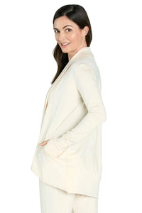 Woman wearing soft almond beige long sleeve Pima cotton loungewear cardigan with pockets