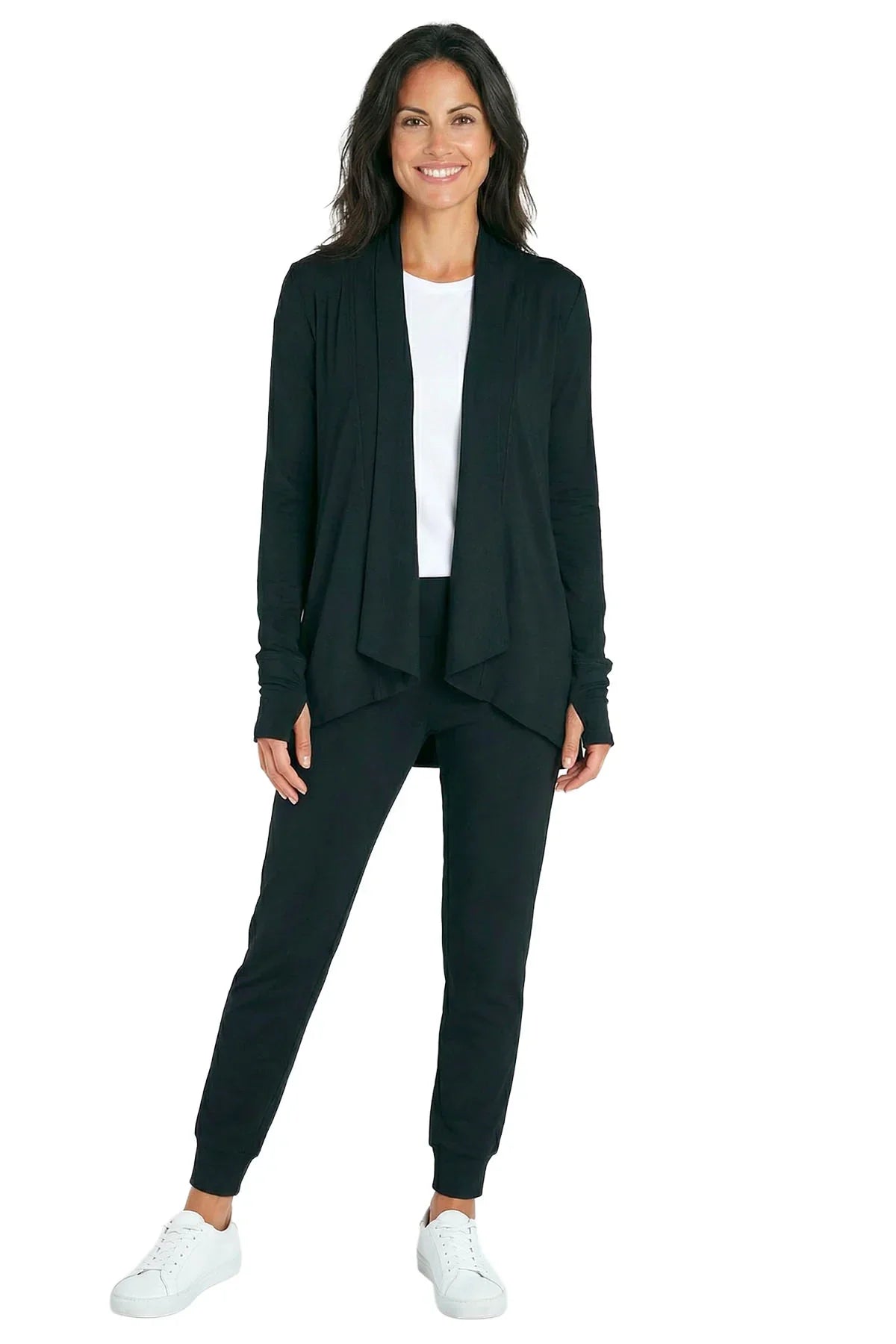 Woman wearing black loungewear cardigan and jogger pants set with white tee