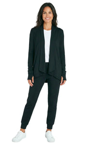 Woman wearing black loungewear cardigan and jogger pants set with white tee