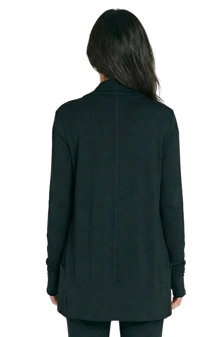Back view of woman wearing black long sleeve loungewear top, relaxed fit