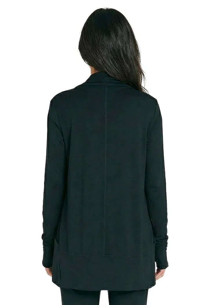 Back view of woman wearing black long sleeve loungewear top, relaxed fit
