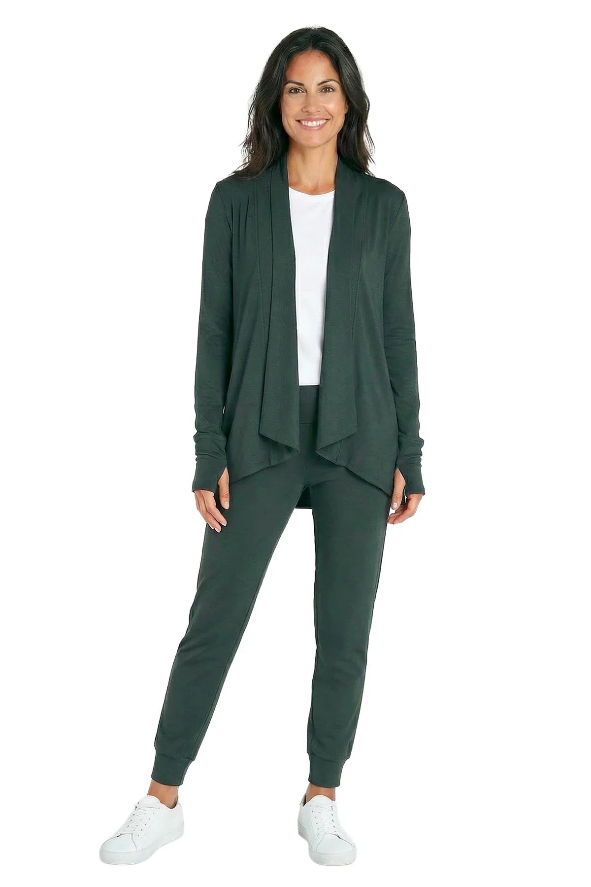 Woman wearing dark green loungewear set with cardigan, joggers, and white sneakers