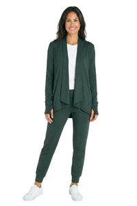 Woman wearing dark green loungewear set with cardigan, joggers, and white sneakers