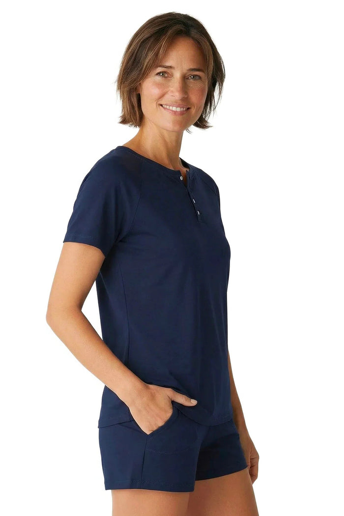 Woman wearing navy blue Pima cotton short sleeve lounge sleepwear set with buttons