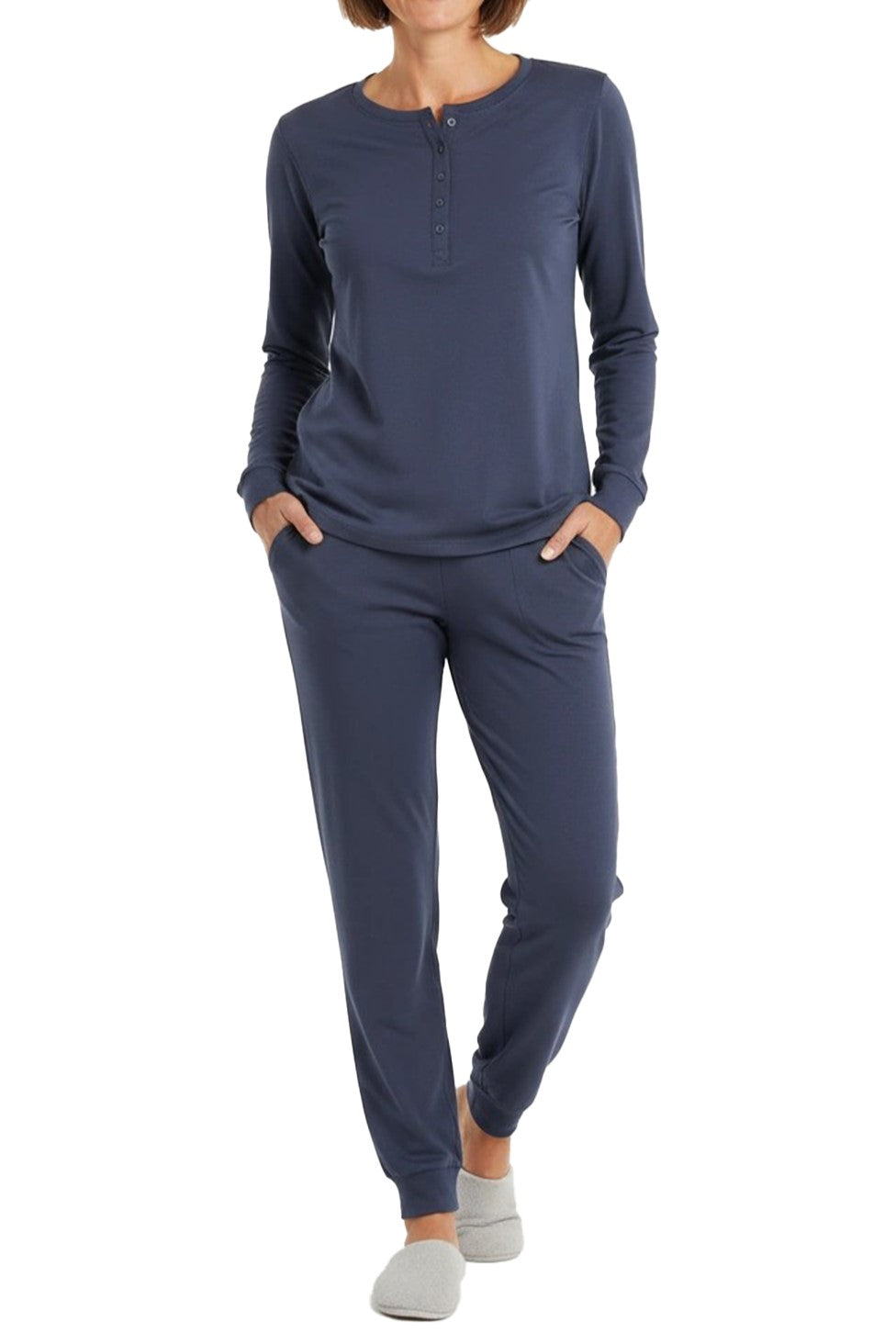 Woman wearing a long sleeve steel blue loungewear set  on a white background