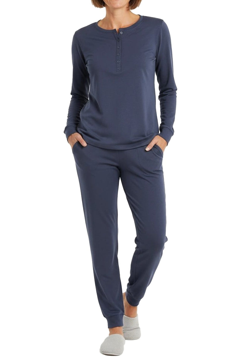 Woman wearing a long sleeve steel blue loungewear set  on a white background