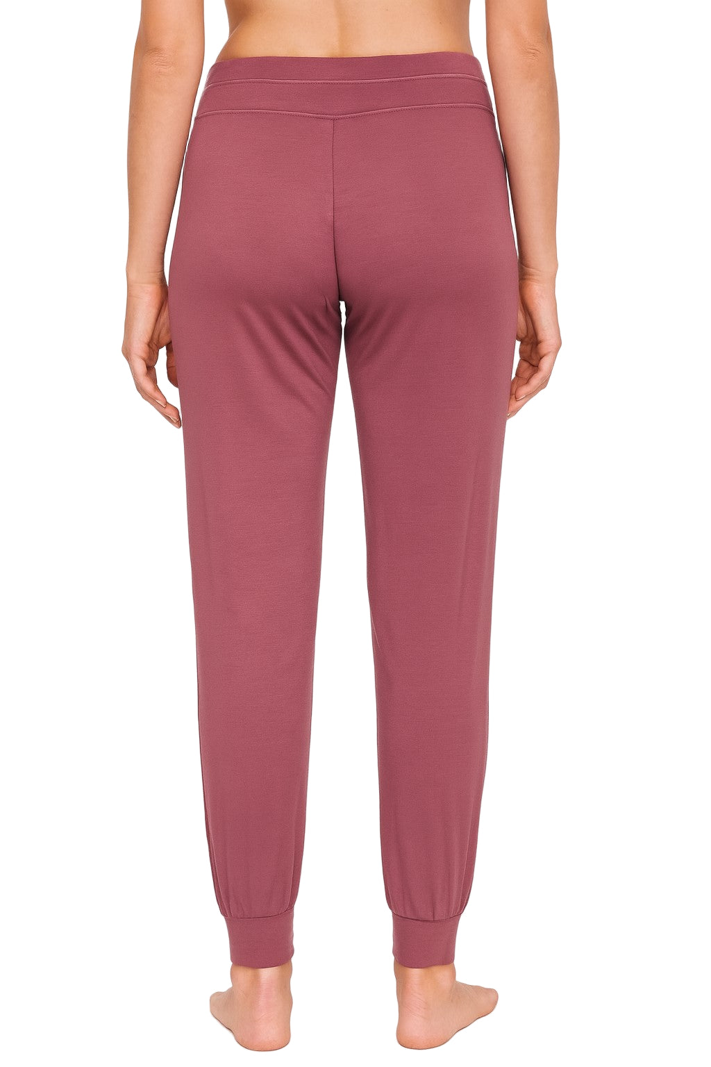 Rearview of rosewood colored joggers worn by a woman on a white background