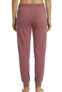 Back view of rosewood pink Pima cotton lounge pants with elastic waistband and cuffed ankles