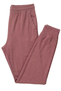 Rosewood pink Pima cotton lounge pants with pockets, laid flat on white background