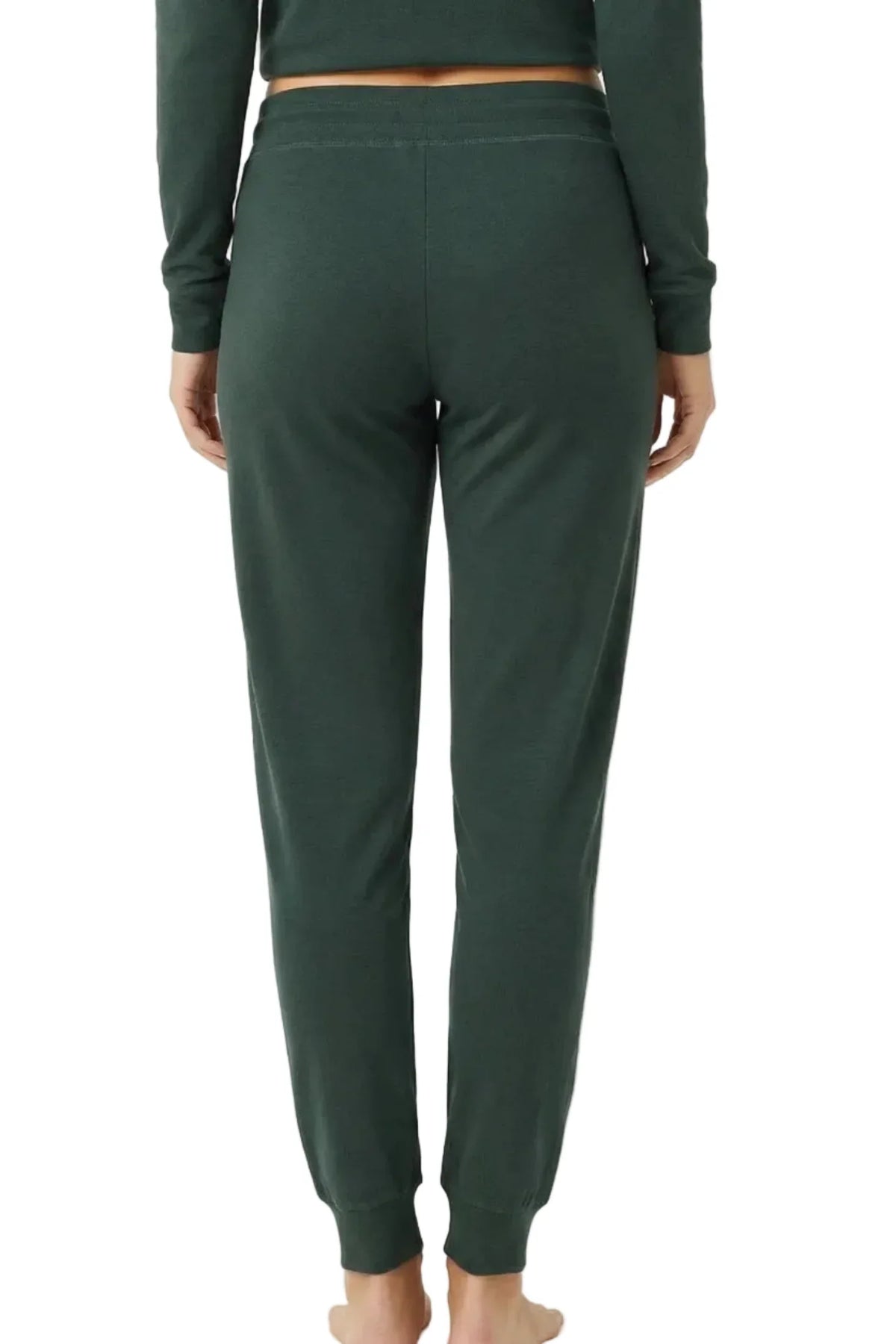 Back view of woman wearing dark green Pima cotton jogger loungewear pants