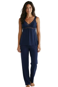 Woman wearing indigo Pima cotton lace trim sleepwear set with camisole and pants