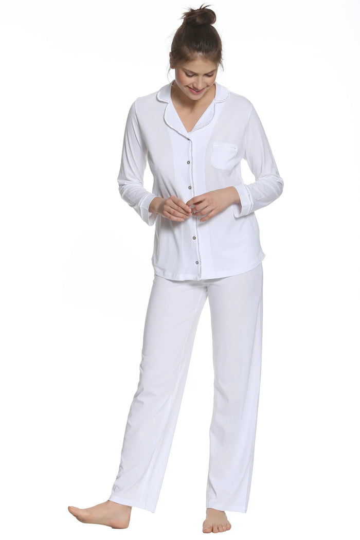 Woman wearing white Pima cotton long sleeve pajama set with button-down top and pants