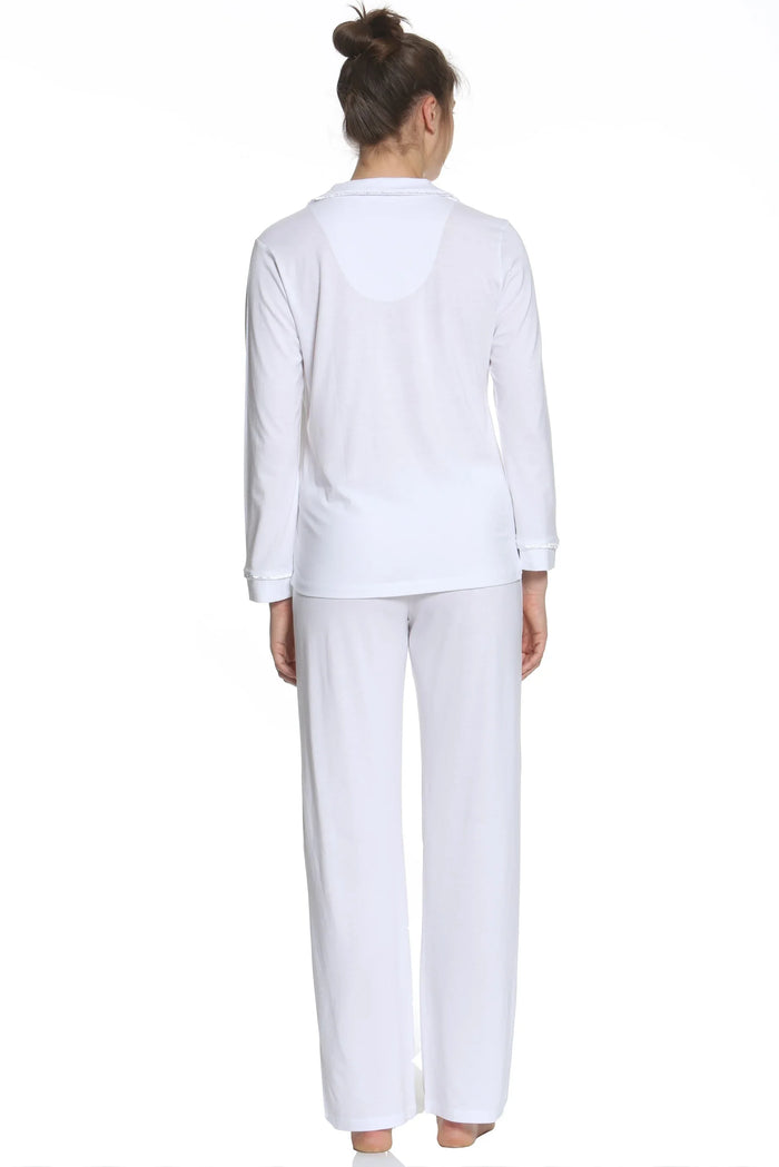 Woman in white long sleeve loungewear pajama set, back view, barefoot