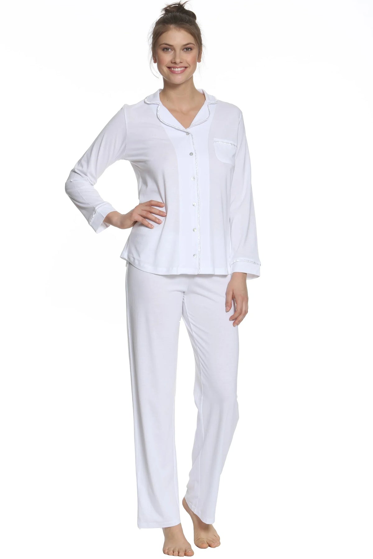 Woman wearing white Pima cotton long sleeve pajama set, relaxed fit loungewear