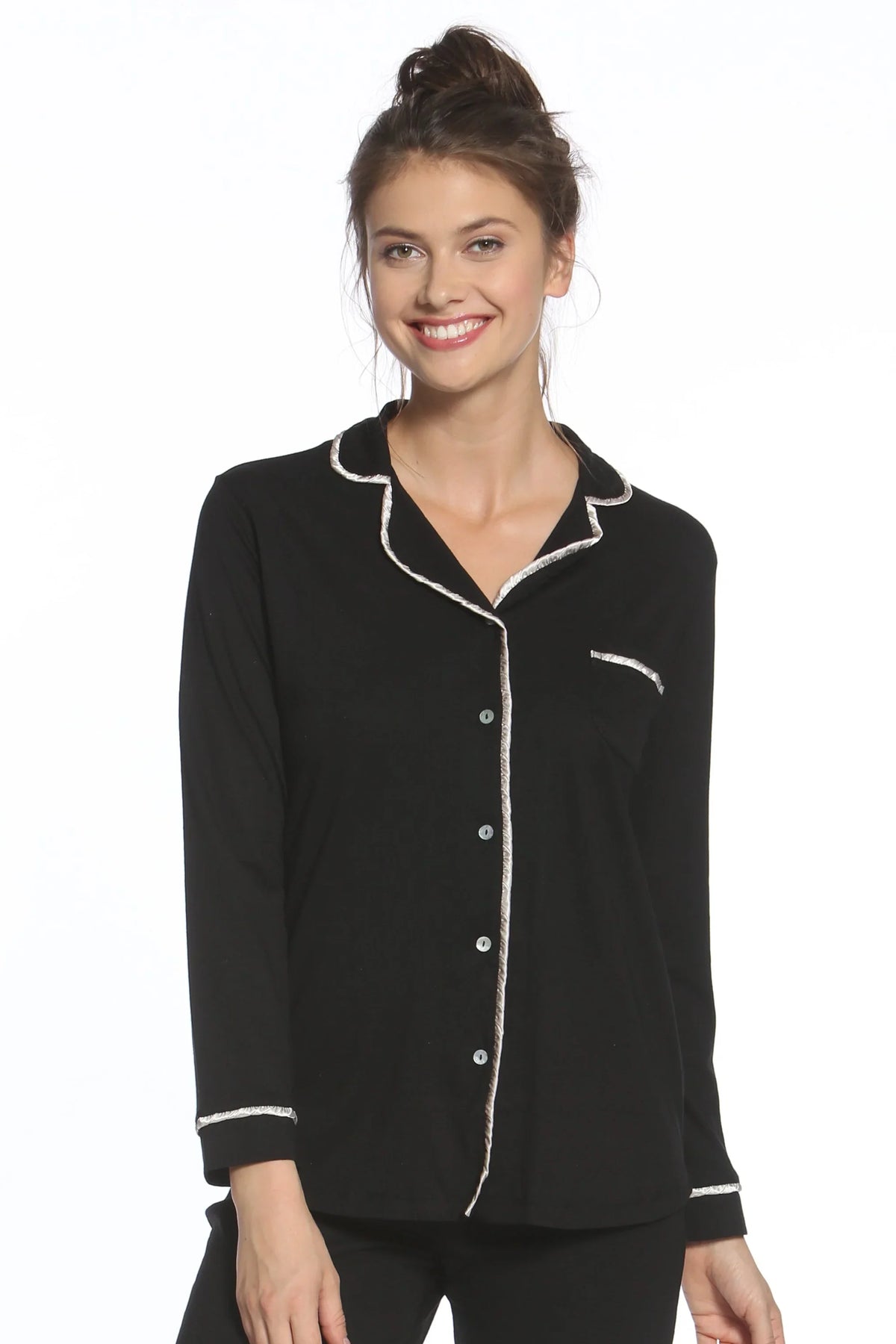 Woman wearing black long sleeve pajama top with white piping, button front, loungewear