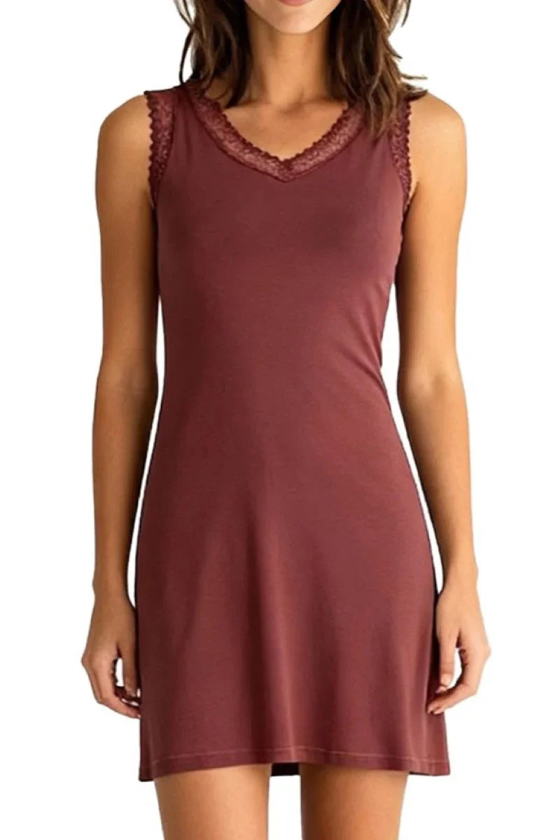 Woman wearing sleeveless Bordeaux-colored dress with lace trim on neckline and shoulders