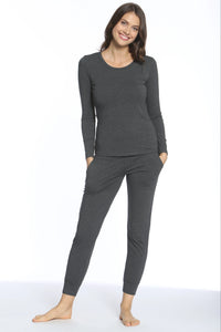 Smiling woman wearing dark charcoal long-sleeve top and matching jogger pants loungewear set
