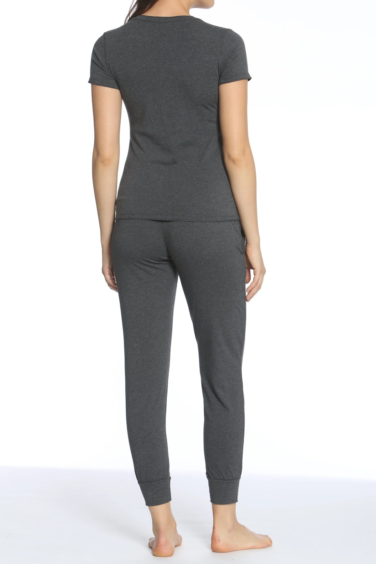Back view of woman wearing heather charcoal gray short sleeve top and jogger pants loungewear set barefoot
