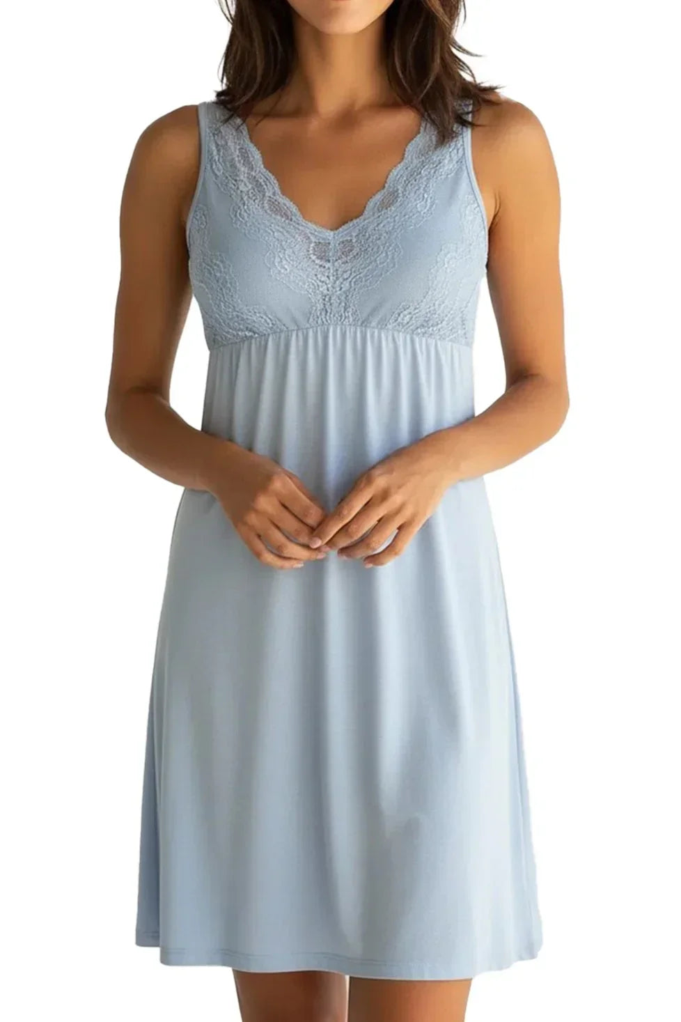 Woman wearing light blue sleeveless chemise with lace V-neckline and empire waist
