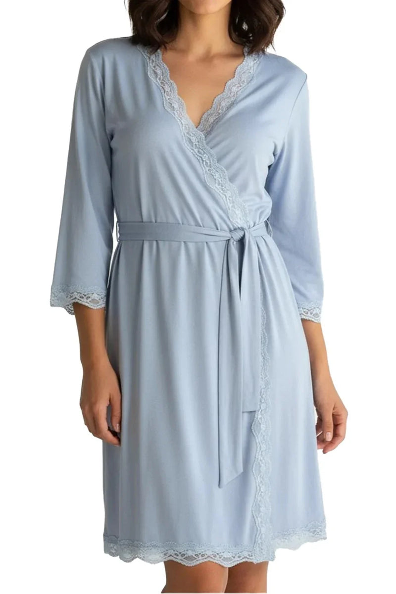 Woman wearing light blue chambray robe with lace trim and waist tie, three-quarter sleeves