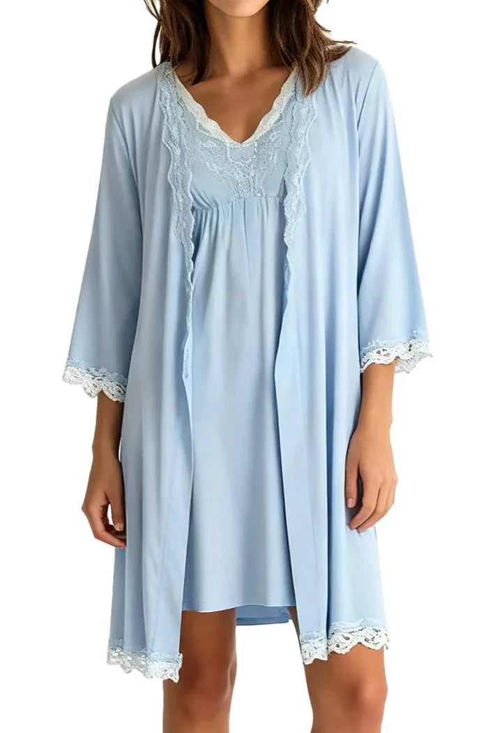 woman wearing light blue chambray nightgown and matching robe with lace trim on sleeves and hem