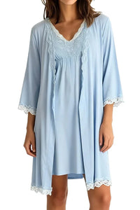 woman wearing light blue chambray nightgown and matching robe with lace trim on sleeves and hem
