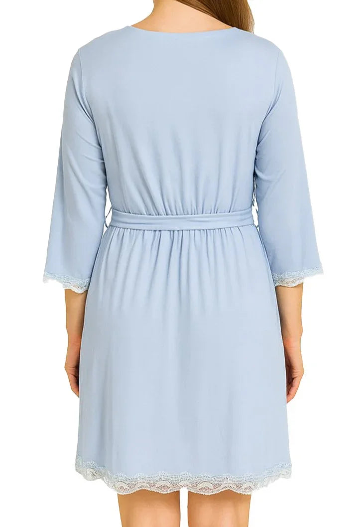 Back view of woman wearing light blue knee-length robe with lace trim and 3/4 sleeves