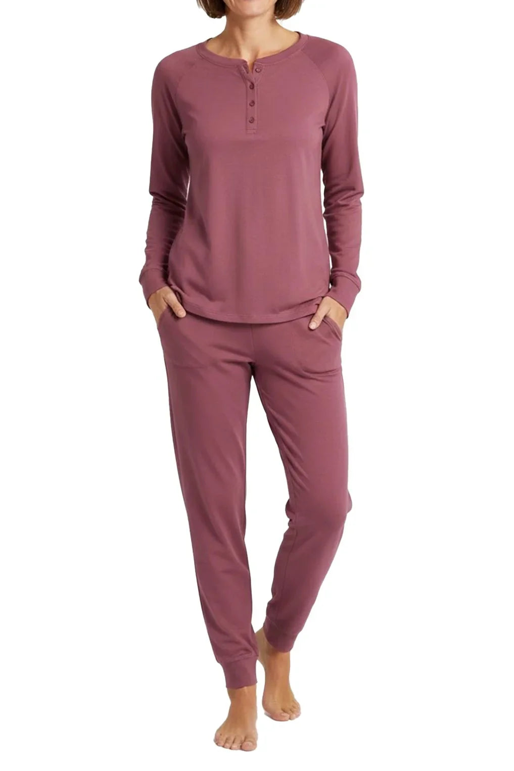 Woman wearing rosewood long sleeve henley top and matching jogger pants loungewear set