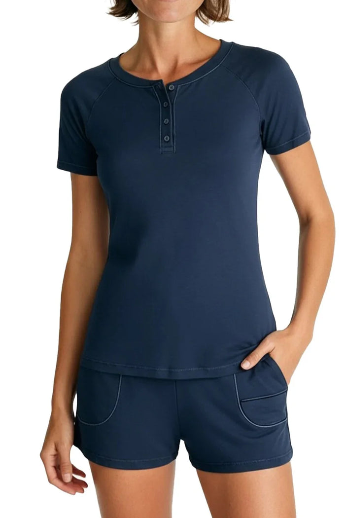woman wearing steel blue short sleeve henley shirt and matching shorts with pockets
